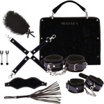 The Rianna S Kinky me softly black handbag kit, 7 piece is the perfect accessory for the adventurous and stylish woman who loves to explore her kinky side. This set of 7 includes a feather, nipple clamps, hand and ankle cuffs that can be attached or detached from a joiner, it also includes a blindfold and flogger with wrist band. All of this comes in a gorgeous fold out 40cm by 31cm black handbag.