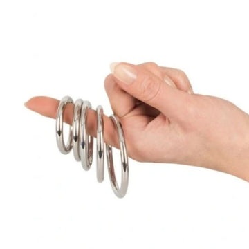 We bring you a stunning set of 5 solid rings by Bad Kitty. Slip the ring or rings of choice over your penis and/or shaft and testicles for gentle to intense constriction, which may prolong your sessions and the ultimate finish. Diameters measure: 1.3, 1.35, 1.5, 1.8, 2.1 inches.