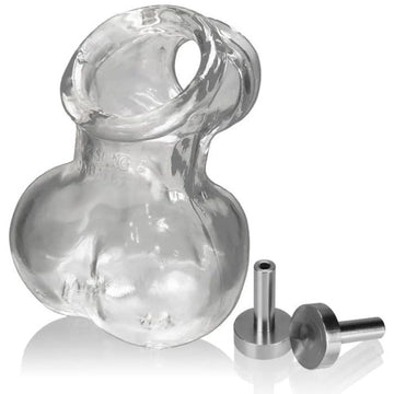 Oxball Sacksling 2 has a built in cocksling with a stretchy sack for your scrotum. Wear it for an intense session or under your clothes to create a bulge. The sack features a drainage hole that doubles as a contact opening for electro contacts points, for those who enjoy a more shocking experience. Made from FLEX TRP. Cock and Ball Hole Circumference: 5.24 cm, Ballbag Opening Circumference: 10.16 cm Ballbag Outer Circumference: 22.86 cm.