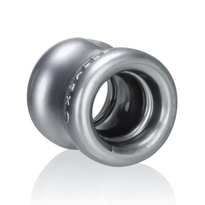 The Oxballs Ball Stretcher was designed to stretch the scrotum for a lower hanging swing. Each stretcher was designed with a squishy padding on the top and the bottom for more comfort, making sure to pull your testicles away from your body at the same time. The stretcher was designed to melt to your body like a second skin, the curved design holds you tight without strangling you. Made from FLEX-TPR.