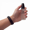 Frosted glass bottle of Pheromone Female Andro Vita for major effect in hand