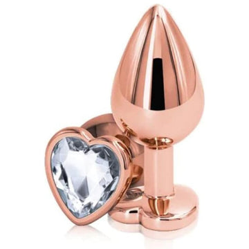 Rear Assets Rose Gold Anal Plug with Clear Stone Heart - Medium. Anal play has never been a prettier sight with this gorgeous jeweled, steel anal plug. Bulbous in form, a tapered tip ensures an easy introduction, while the broad steel bulb fills and satisfies. Perfect for anal enthusiast.