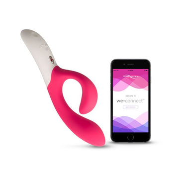 Pink and white We-Vibe Nova Vibrator next to smartphone with app for vibration patterns
