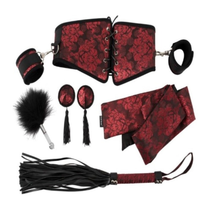 The Bad Kitty Bondage 6 piece Set in a gorgeous Red & Black floral pattern is the perfect addition to your bondage collection. This set includes a wrist restraint that is attached to an incredibly sexy corset/waist belt, which is both comfortable and adjustable. The set also includes matching nipple pasties, leatherette G-string, elegant blindfold and flogger.