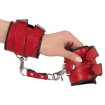 Handcuffs on wrist.