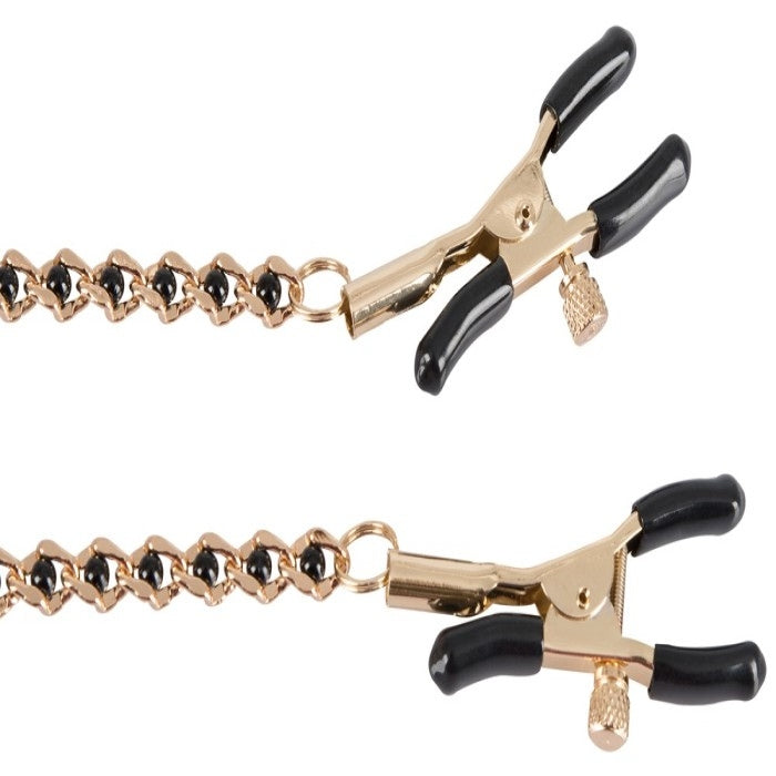 Gold adjustable nipple clamps with black silicone tips for comfort.