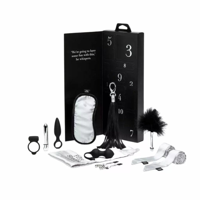 Prepare yourself for an incredible ten days where you will enjoy intimacy with the Fifty Shades of Grey Pleasure Overload 10 Days of Play Gift Set. This enticing gift box includes trinkets for him, for her, and for both of you. Includes: Vibrating Love Ring, Bullet Vibrator, Kegel Balls, Mini Pleasure Plug, Nipple Clamps, Blindfold, Feather Tickler, Mini Flogger, Silky Restraints, Satin Toy Bag.