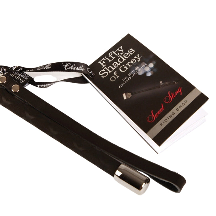 Enliven bedroom bondage play with sensual strokes and punishing spanks from this slender riding crop whip. Sweet Sting boasts leather detail to the wrist strap and tip, a braided stem and a soft rubber handle. Part of the Fifty Shades of Grey The Official Pleasure Collection approved by author E L James.