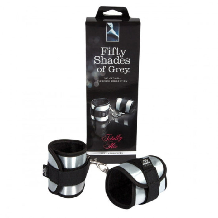 Fifty Shades of Grey Totally His handcuffs are a high-quality bondage accessory designed to take your pleasure to the next level. Made from durable materials, these handcuffs are designed to be comfortable, easy to use, and provide a secure fit that won't slip or chafe during play. 