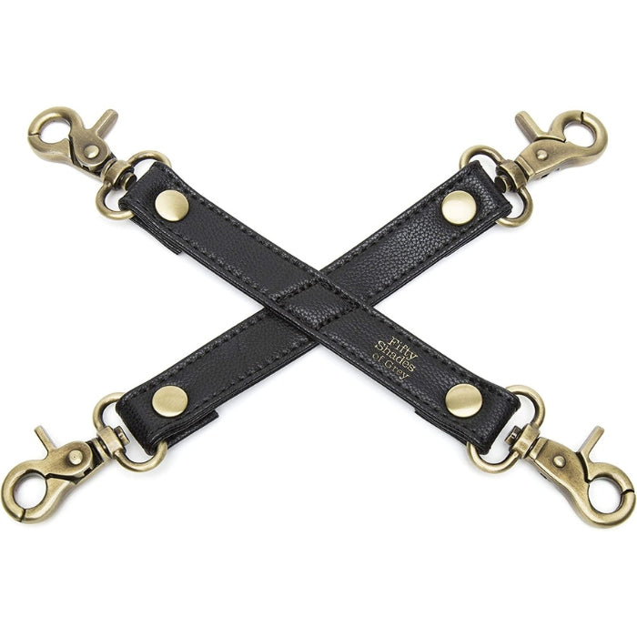 Fifty Shades of Grey Hogtie - Bound to You Black is a light weight, strong and durable handcrafted faux leather hogtie with antique gold hardware with 4 x swivel lobster clasps. This versatile Hogtie is compatible with the Fifty Shades of Grey - Bound to You Black Ankle Cuffs and Wrist Cuffs.