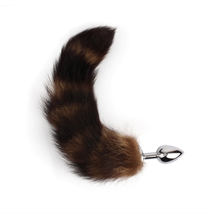 Unleash your wild side with the Frisky Fox Tail Butt Plug in Brown - Small. This playful accessory combines an intimate experience with a touch of animalistic allure. The small size ensures comfort and ease of use, while the realistic fox tail adds a unique visual element.