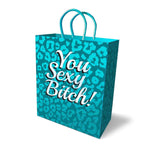 Unlike other gift bags, you’ll be proud to wrap your naughty gifts in these playfully suggestive bags. High quality, unique luxury gift bags made of thick, sturdy cardstock paper with elegant woven handles. This teal colored 10-inch gift bag with all-over teal glitter leopard pattern and a silver foil stamp phrase “You Sexy Bitch!” imprinted on both front and back. This delightful bag is as fun to give as it is to receive.