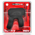 The Hünkyjunk Revhammer penis strap is a cockring plus shaft-ring that puts the vibe lengthwise up on top. Revhammer straps on with a rubbery cock ring in the back, the vibe lays on top of your penis and the front ring stretches around your shaft about 1-1.5” from the base. The rings secure the reverb-vibe. The rubbery-firm plus+silicone mix is super-soft stuff with a slick smooth velvet finish that’s super-rubbery tough. Waterproof, buttery operated (batteries included), stretchy so one size fits all.