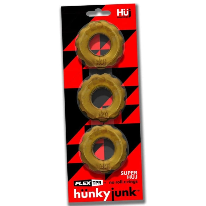 Stacking or stretching 3 pack non roll cock rings by hünkyjunk. The pack of three also makes gradual ballstretching easier, start with one, add more as you need more stretch or with one or two as a cockring and the others as a ballstretcher. Designed with a lube channel inside for less snag/pinch and a inner curve that flattens as you stretch to help keep the cock ring where you put it. Width: 2”/ 5 cm, Depth: .6/ 1.5 cm, Outer circumference: 6.75”/ 17 cm, Inner Circumference: 3”/ 8 cm.