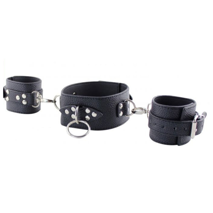 MOI lets you take control with this stylishly designed set of restraints. The collar has detachable hand cuffs with an easy to use fastener. These versatile restraints can be used in multiple different ways. The Collar also features a ring for a leash to be attached. Use the cuffs attached to the collar or remove and use for hand restraints alone. Let your dominant or submissive side come out to play, fulfilling your wildest fantasies.