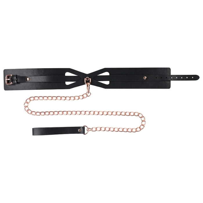 Introducing the Sex & Mischief Brat Collar and Leash – a stylish and provocative addition to your intimate play. The Brat Collar is crafted with both comfort and aesthetics in mind, offering an adjustable fit to suit various sizes, with a rose gold chain leash attached. The sleek design and durable construction make it perfect for beginners exploring BDSM or those looking to enhance their collection of playful accessories.