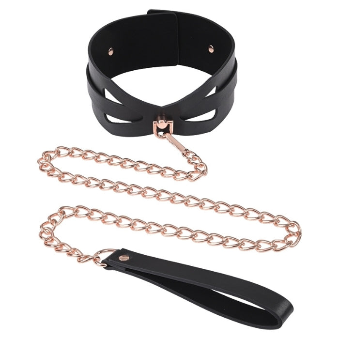 Introducing the Sex & Mischief Brat Collar and Leash – a stylish and provocative addition to your intimate play. The Brat Collar is crafted with both comfort and aesthetics in mind, offering an adjustable fit to suit various sizes, with a rose gold chain leash attached. The sleek design and durable construction make it perfect for beginners exploring BDSM or those looking to enhance their collection of playful accessories.