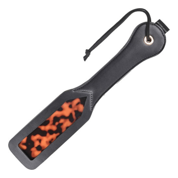 The impact of this spanker is seen and felt. The multiple layers of gold and Amber tortoiseshell pattern add style and intensity to your session, making the Sincerely Amber Spanker look as good as it feels. The handle features a spring steel center so you can feel the power of this toy. Use the attached leash to hang it up when you're done.