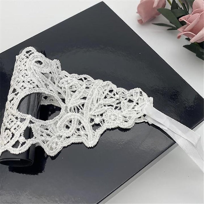 White Lace Mask with Satin Ties — a delicate and alluring accessory designed to add an air of mystery and elegance to your intimate moments. This lace mask combines sophistication with a touch of playfulness, enhancing the intrigue of any encounter.