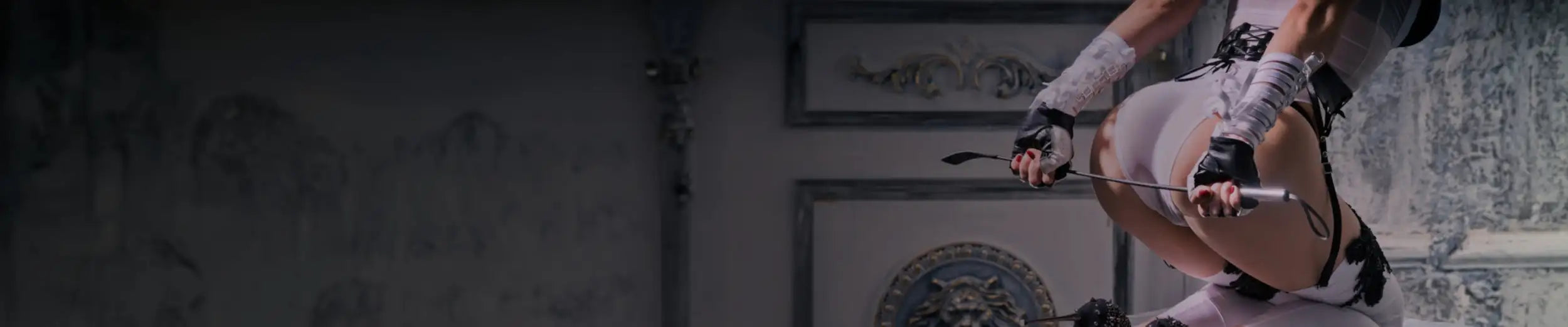 Black high-heeled shoes with sparkling embellishments on the toe caps.