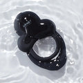 Black glossy silicone vibrating double cock ring with heart top and honey play box logo for erection firmness and thrust count