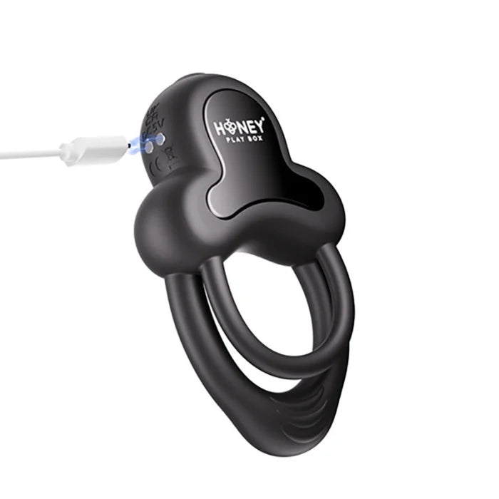 Black silicone anello vibrating double cock ring with clitoral stimulator features sleek design and integrated charging port for erection firmness and long distance control