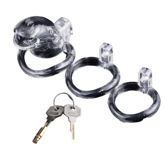 Brutus Shark chastity cage clear with black rings and transparent lock designed for denial play and lightweight feel