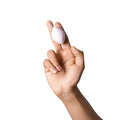 A soft pale pink silicone dame fin 2.0 finger vibrator with a smooth rounded teardrop shape for play