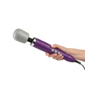 Electric Doxy Wand Massager with purple handle and gray head held in hand