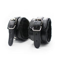 Black leather cuffs from everything bondage 12 piece kit with silver buckles and plush faux fur lined interior