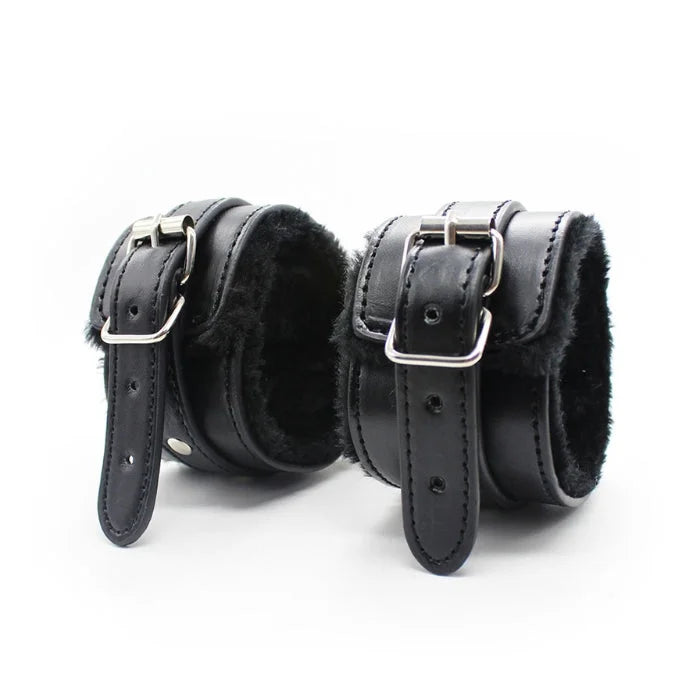 Black leather cuffs from everything bondage 12 piece kit with silver buckles and plush faux fur lined interior