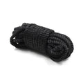Black braided rope tightly coiled in a bundle from the everything bondage 12 piece kit with cuffs faux fur lined options