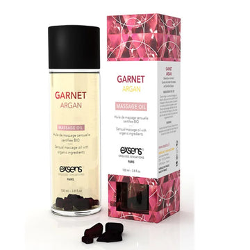 Exsens garnet massage oil 100ml in a clear glass bottle with argan oil and garnet elements in golden-yellow liquid