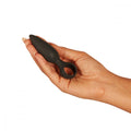 Black silicone anal plug held in a hand from Fifty Shades of Grey for ultimate pleasure