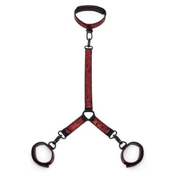 Made with soft padding in a beautiful faux leather, rose-patterned, black-and-red colorway. Beautifully crafted with padding and a reversible design, these cuffs and collar are fully adjustable via a six-hole buckle to give you the perfect fit. Thanks to a connecting chain with quick-release clips, your restraint adventures are both secure and safe. What's more, a D-ring to each wrist cuff means adding other restraints is easy.