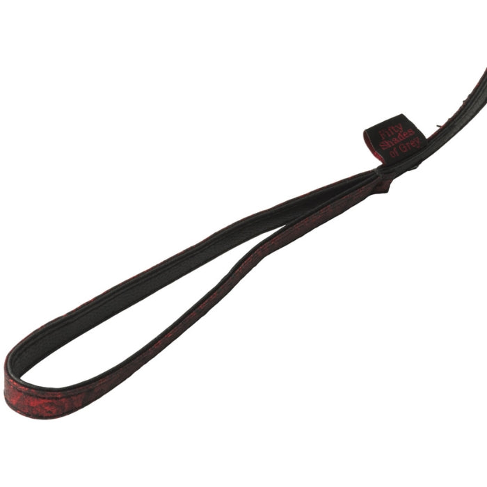 The Fifty Shades Of Grey Sweet Anticipation Collar & Leash will satisfy those wicked desires. Designed with a D-ring to the front of the collar to attach the leash or other bondage attachments. Soft padding around the collar for comfortable use, and reversible; sexy black and rosy red finish. Made with nickel-free metal hardware, adjustable to work with all sizes. The perfect versatile toy for your BDSM plays and collection. Branded storage bag included.