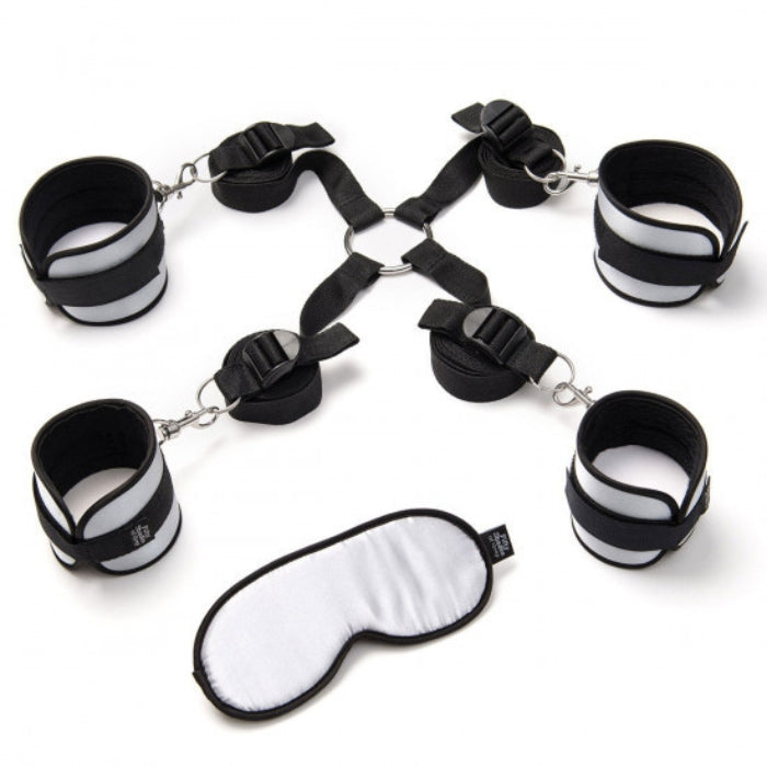 The restraint kit expertly turns your bed or other furniture into a bondage playground. The adjustable restraint straps can be tied to anything, including chairs, doors and can be used as an effective hogtie or bed restraints. The soft satin wrist and ankle cuffs keep you or your partner firmly in place for exciting bondage games. Slip on the blindfold for extra allure and added sensations.