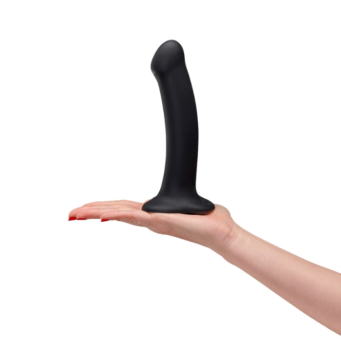 Fun Factory Magnum dildo. If you are looking for size, this definitely lives up to its name. This big boy is great for vaginal and anal play and the curved tip makes for easy insertion and massages the P-spot or the G-spot perfectly. Thanks to the flat suction cup base, it can be used for both vaginal and anal play, and is also harness compatible. It can be stuck to a clean, flat surface or wall for solo play. Body safe materials. 7.5inches