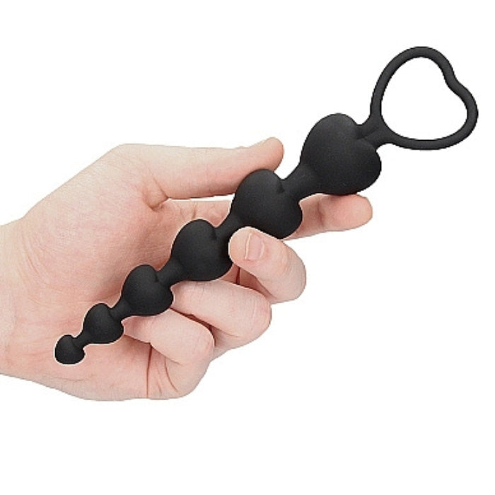 This chain of heart shaped anal beads is a highly functional, high quality toy. The chain is meant for insertion in the anus. At the point of orgasm it can be pulled out for a wonderful climax. Product dimensions 7.28 inches by 1.38 inches by 1.38 inches. Product diameter 1.1 inches. Insertable length 5.63 inches.