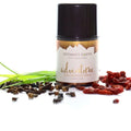 Intimate Earth Adventure Anal Relaxing Serum in sleek black-topped glass bottle