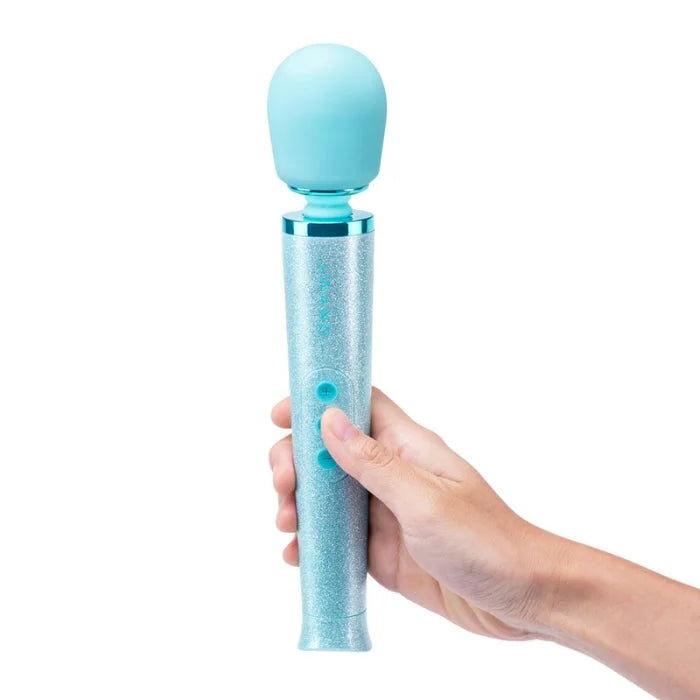 Le Wand Massager All That Glimmers Blue is a light blue glittery wand massager with a smooth rounded head and metallic ring, ideal for women’s health femtech