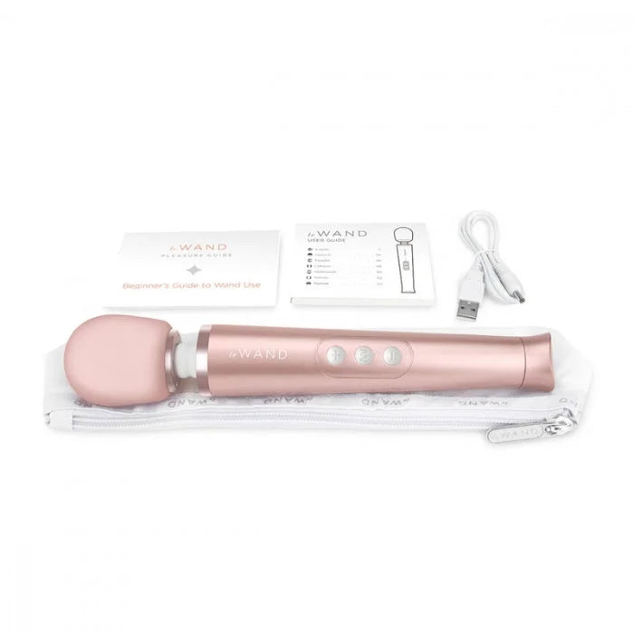 Rose gold le wand petite wand massager with rumbly vibrations and three buttons in clear zippered carrying case