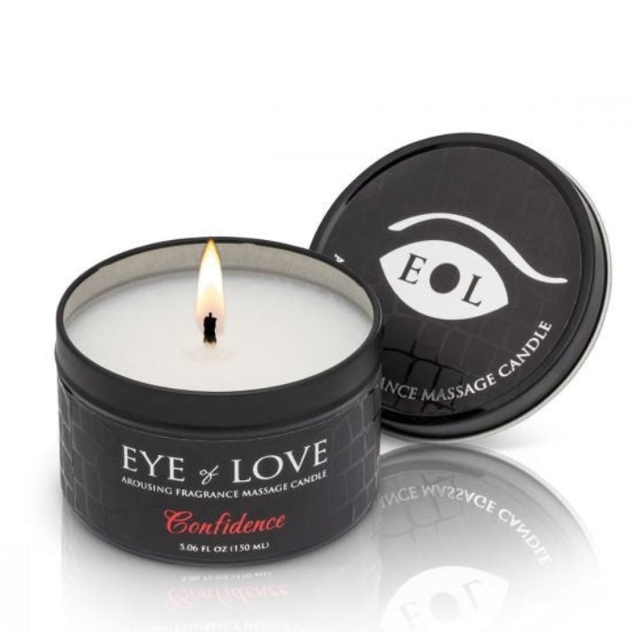 Black Eye of Love Confidence massage candle in textured tin, lit wick
