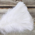 Soft white novelty maid feather duster on rustic wood