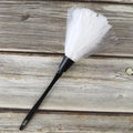 White novelty maid feather duster with black handle for role play