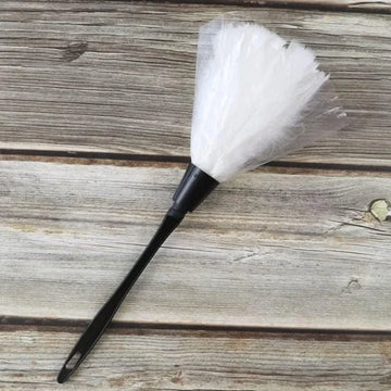 White novelty maid feather duster with black handle for role play