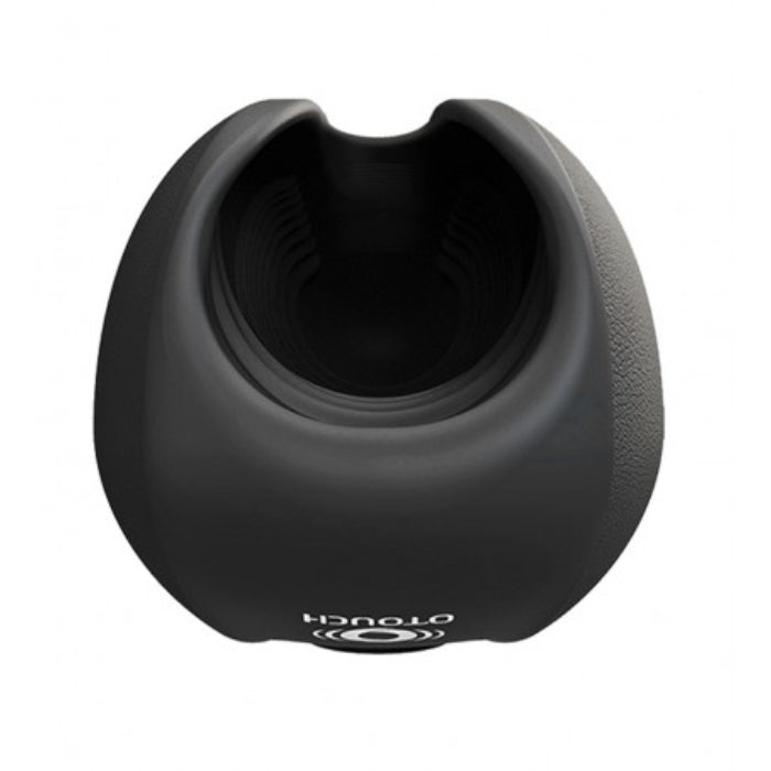 OTouch Deven Pulse penis masturbator with black silicone charging stand and flexible opening