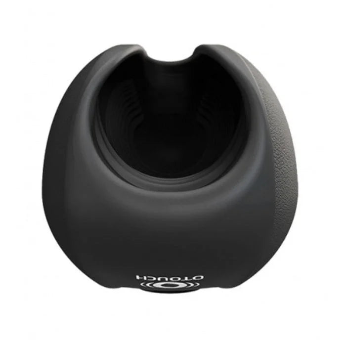 OTouch Deven Pulse penis masturbator with black silicone charging stand and flexible opening