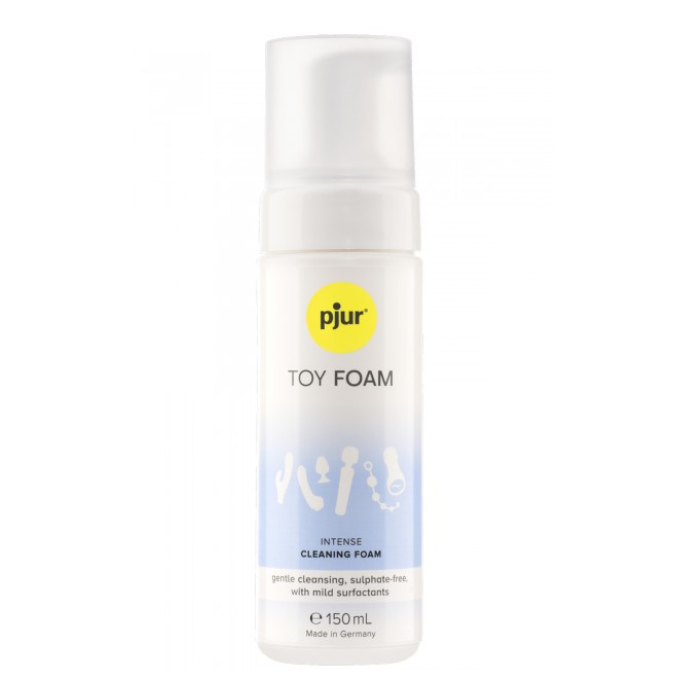 A clear plastic bottle with white pump dispenser labeled pjur toy foam for pjur intense toy cleaner foam spray 150ml