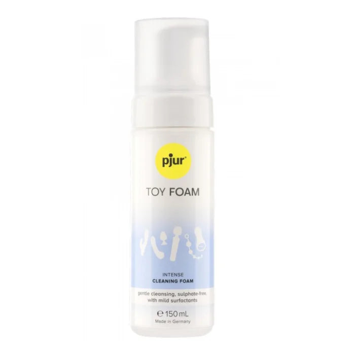 A clear plastic bottle with white pump dispenser labeled pjur toy foam for pjur intense toy cleaner foam spray 150ml